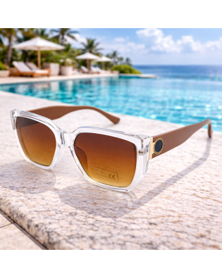 Модерни дамски слънчеви очила с прозрачна рамка и кафяви стъкла – UV 400 защита Модерни дамски слънчеви очила с прозрачна рамка и кафяви стъкла – UV 400 защита